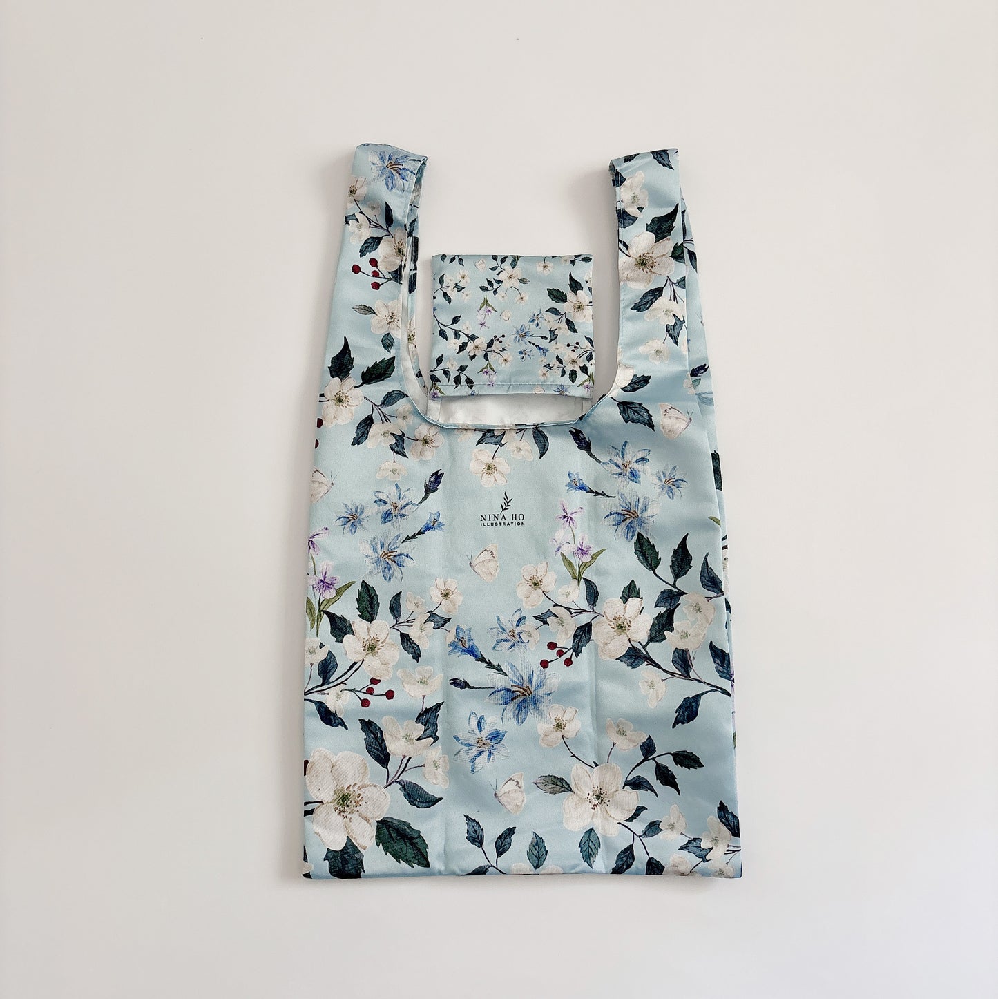 Floral wander reusable bag unfolded, showcasing design and watercolor floral prints.