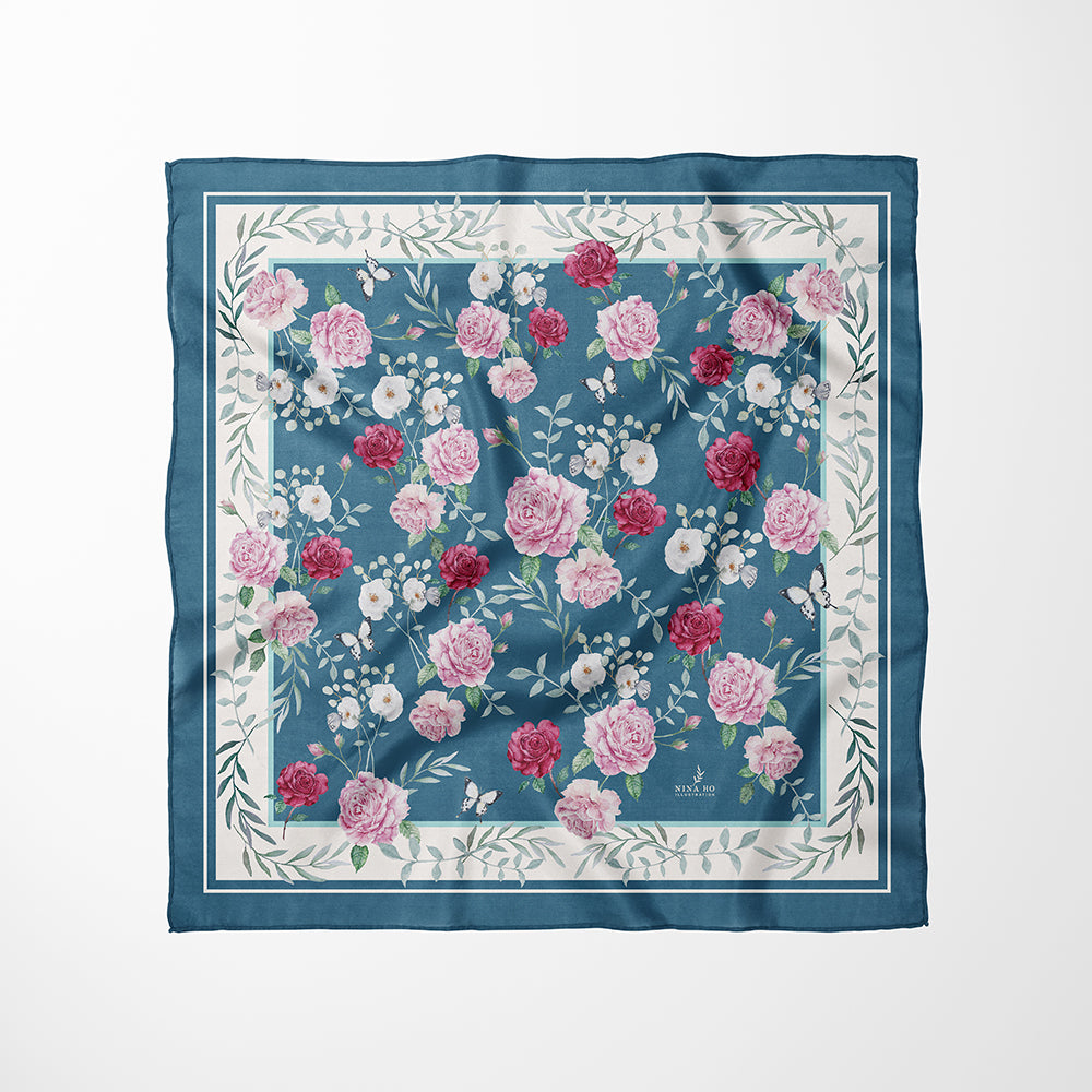 Garden rose silk scarf laid flat, revealing the full watercolor garden scene with blooming roses and white camellias-Nina Ho Illustration