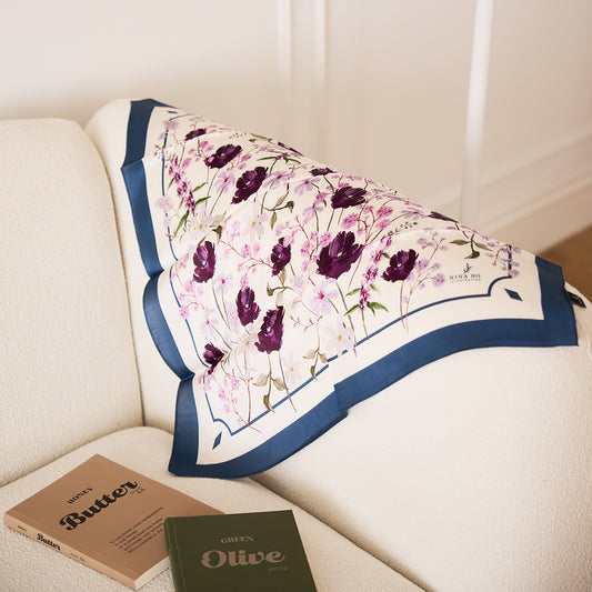 Angel Flower Blessing silk scarf in deep blue-green with angelonia and tulip pattern.Showcasing artistic drape, luxury home lifestyle, and hand-drawn botanical patterns.