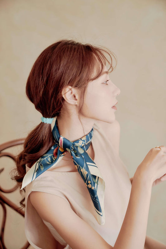 Elegant Floral Party botanical silk scarf in deep blue, styled as a chic neck bow. Perfect luxury gift for her or a sophisticated office wear accessory for women.