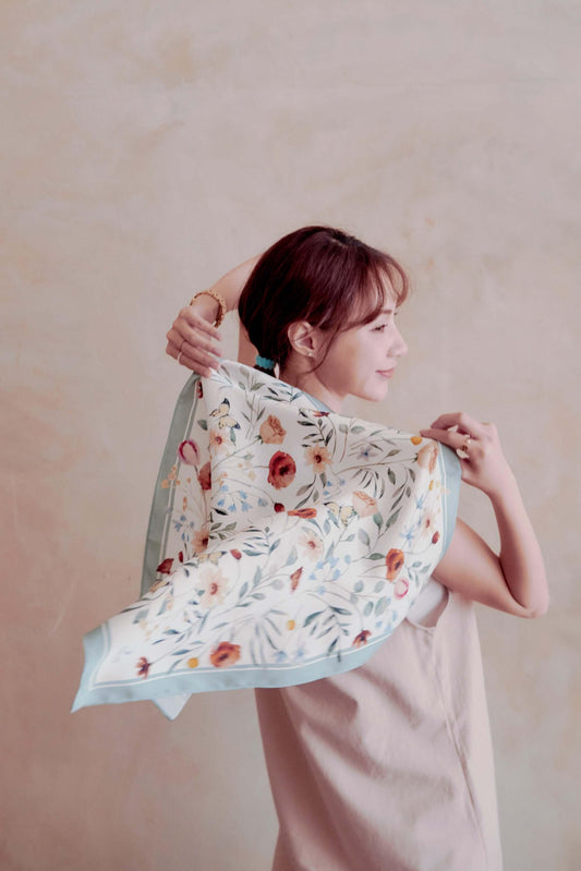 Elegant Floral Party 100% silk neck scarf 23.6"x23.6"(60x60cm) in light blue-green. Showcasing lightweight texture, watercolor butterfly pattern, and sophisticated feminine charm by NINA HO ILLUSTRATION. A unique gift idea or resort wear accessory.
