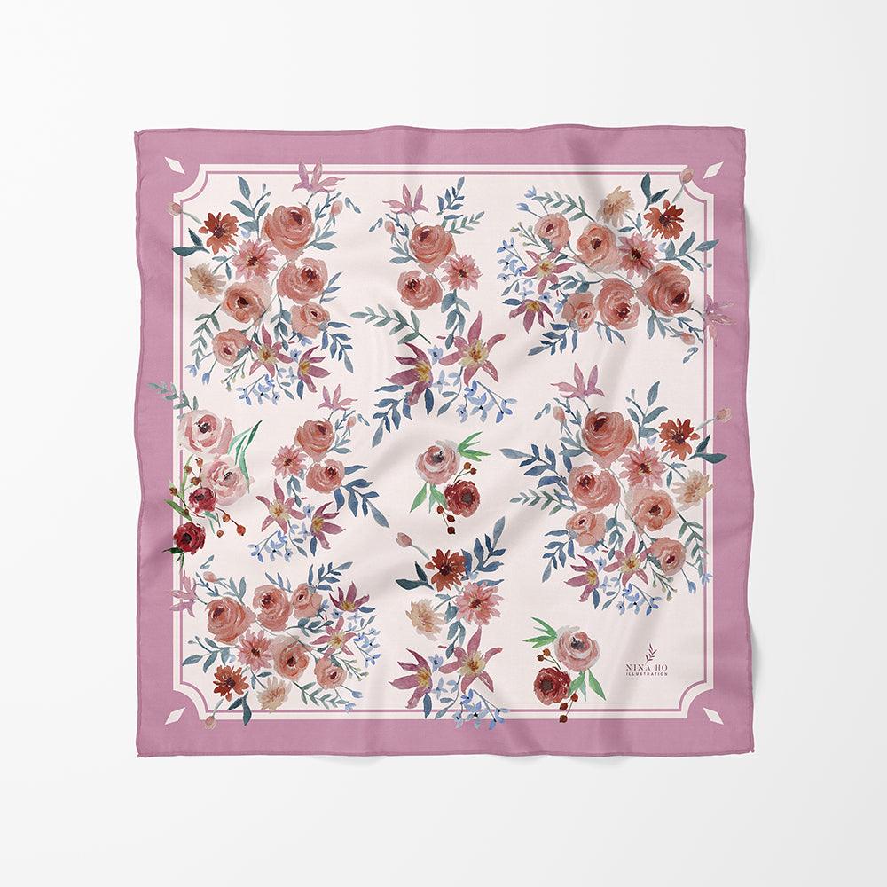 Delicately hand-painted botanical silk scarf with Ranunculus and purple clematis accents framed by a muted Pink Purple by Nina Ho Illustration