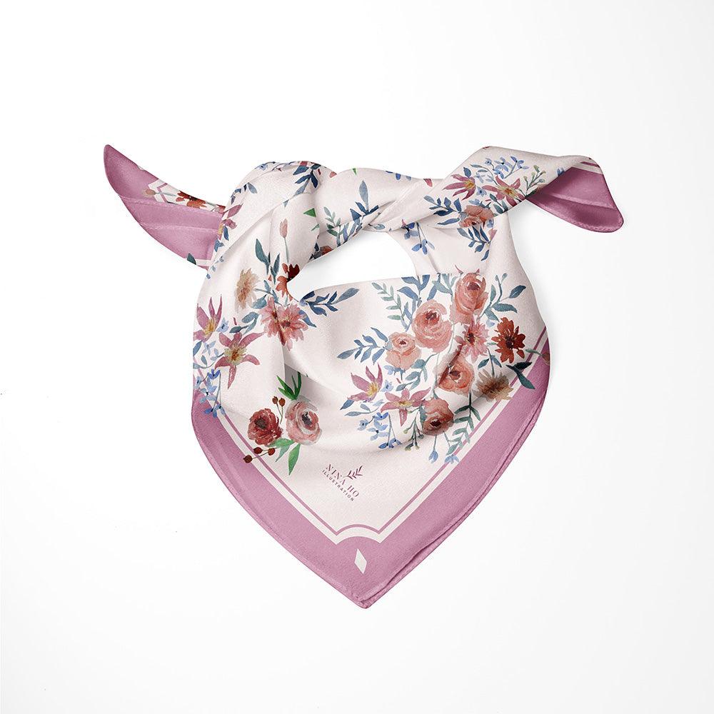 Delicately hand-painted 100% mulberry silk scarf from Nina Ho Illustration, featuring ranunculus and muted blue foliage in refined Parisian chic.