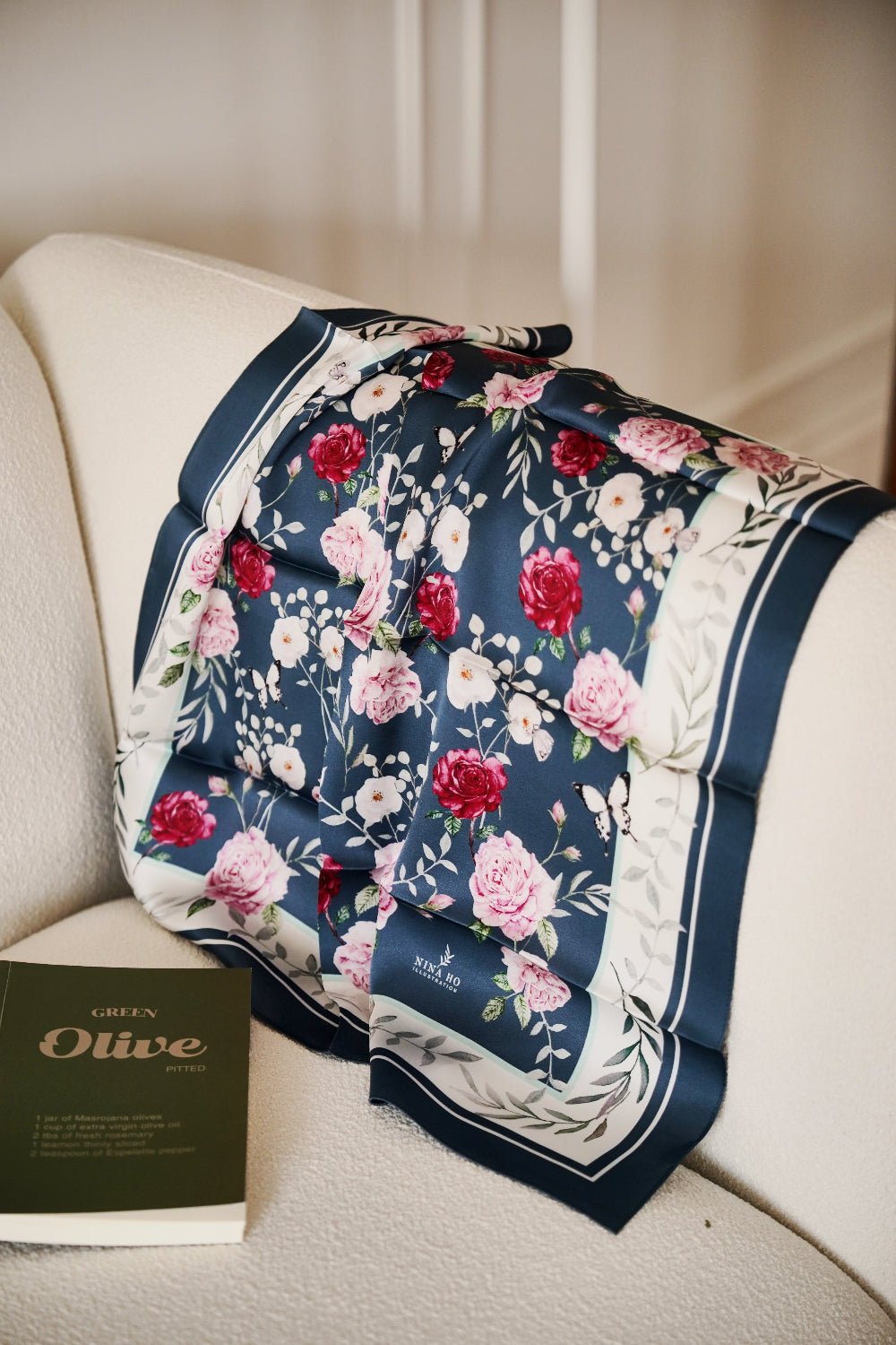 Sophisticated navy silk scarf with hand-painted pink roses and white blossoms, a botanical narrative by Nina Ho Illustration.
